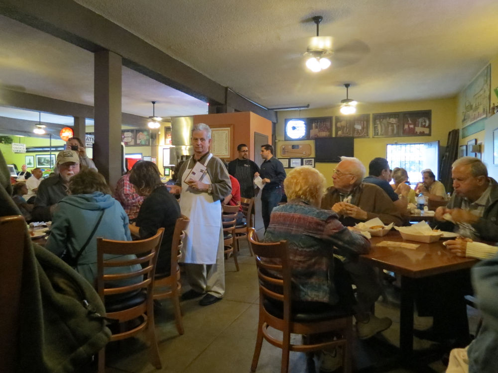 Johnny Angiuli with his customers at Eastside Market and Deli