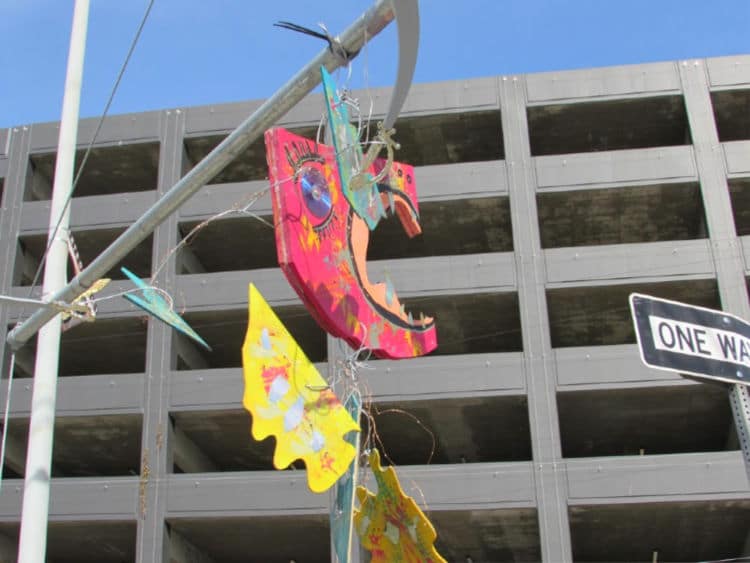 Hanging art from a pole in DTLA.