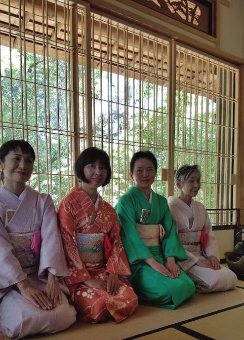 Four geisha performing tea service at Storrier Stearns Japanese Garden.