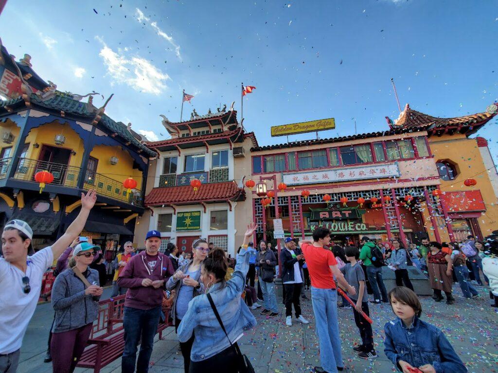 Chinatown Central Plaza with people popping confetti.