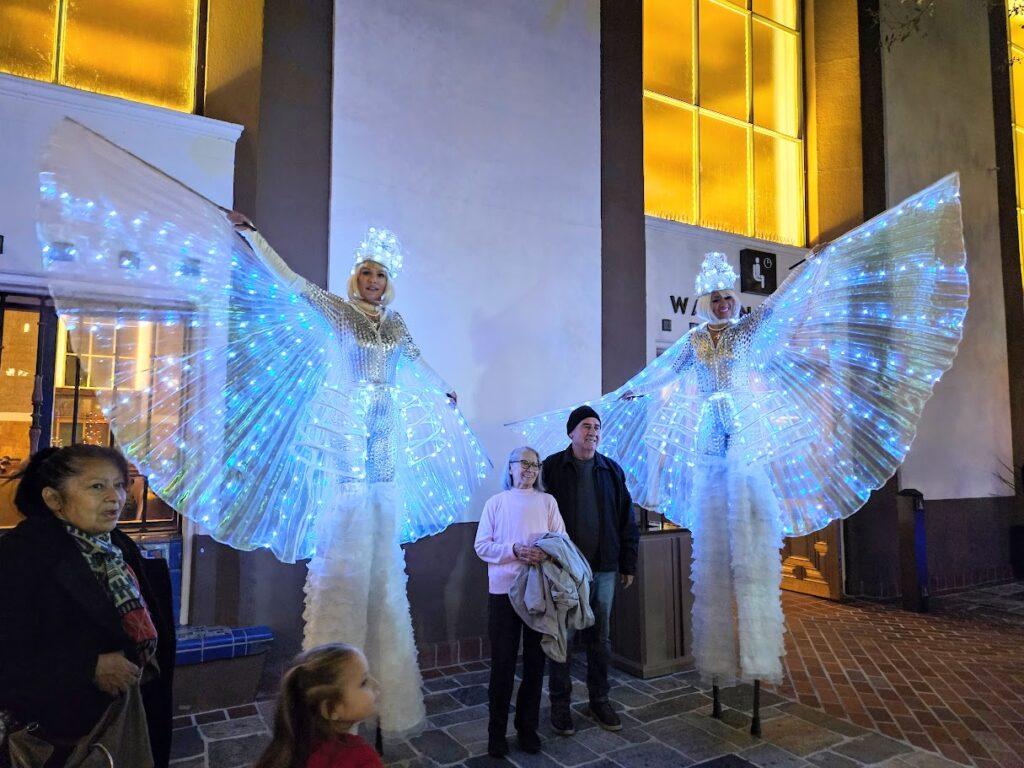 Christmas angels posing with guests