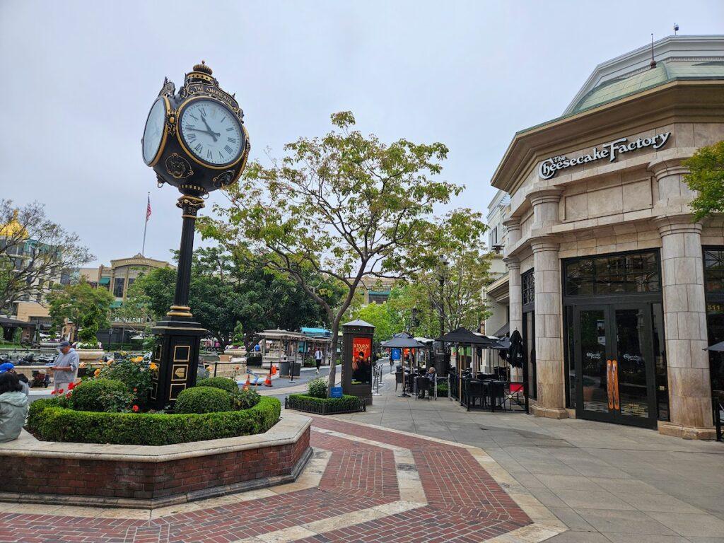 The Americana at Brand Cheesecake Factory and clock