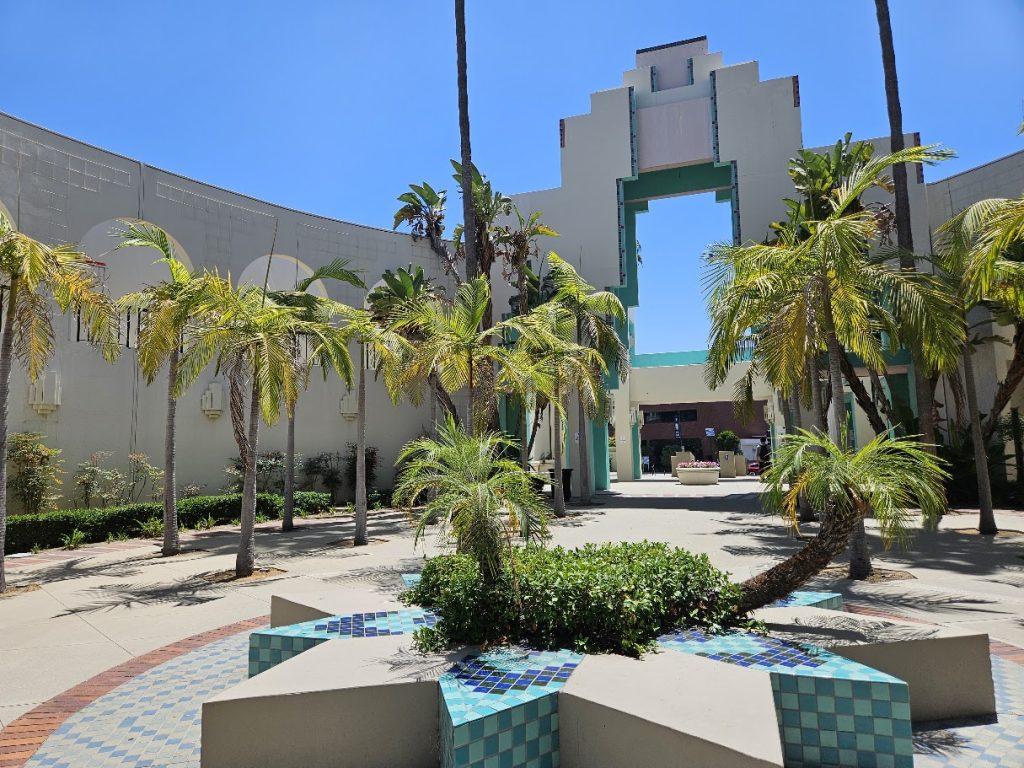 Courtyard of the Beverly Hills Civic Center with a Star shaped bench and greenery.